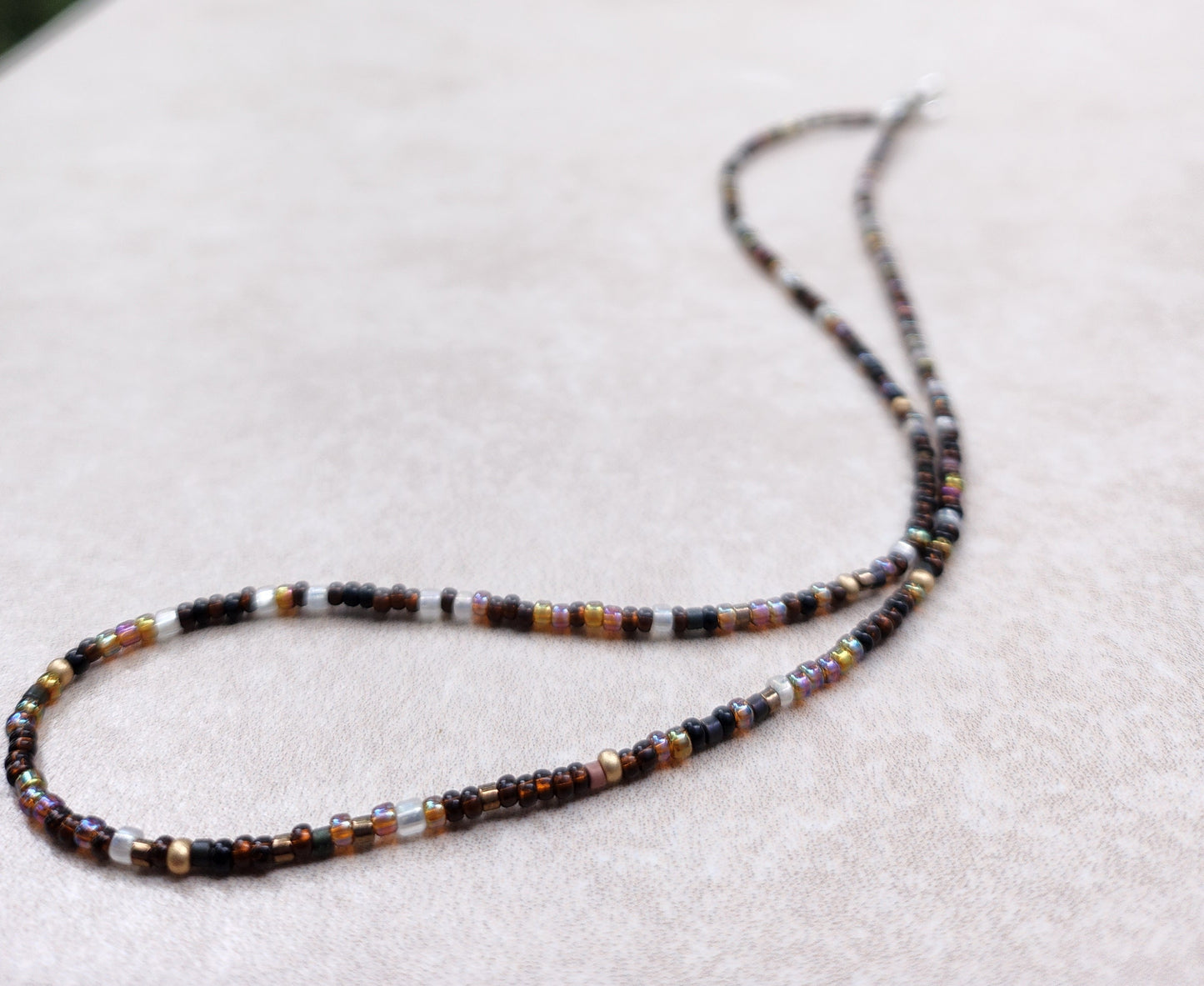 11/0 Galaxy necklace tiny seed bead necklace, black, shades of light and dark brown, gold, frosted crystal, and a sprinkle of dark olive.