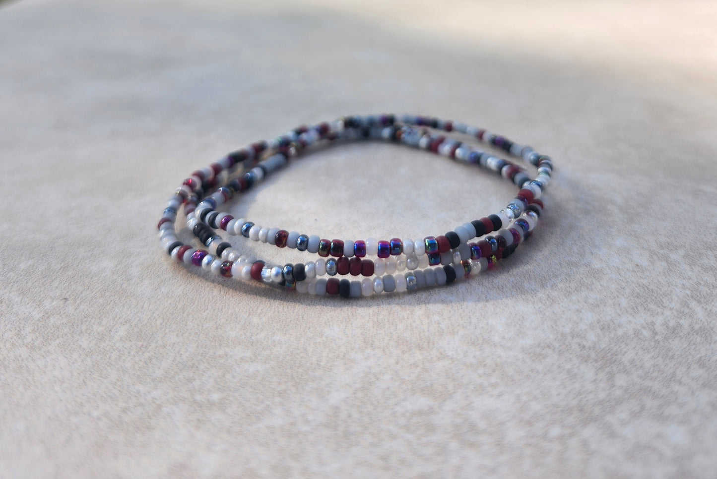 11/0 Plume Set of 3 Tiny Stretch Stackable Seed bead bracelet set, shades of black, grey, garnet ab, purple ab, maroon/dark red hue